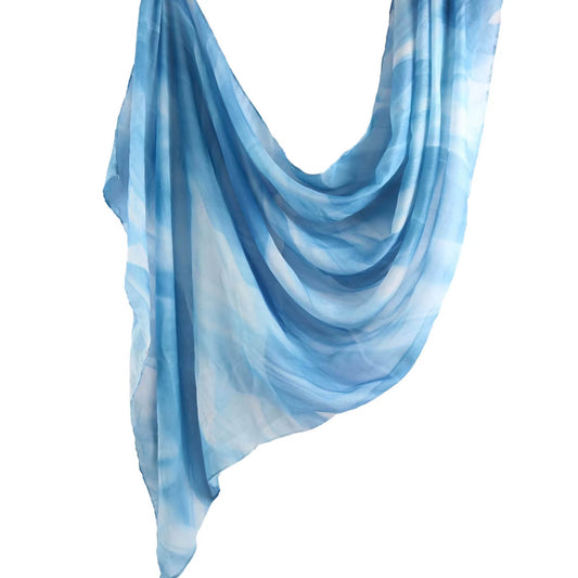 Cotton-modal hijab in a tropical turquoise Ocean shade, soft and breathable with gentle printed texture for modest and modern styling.
