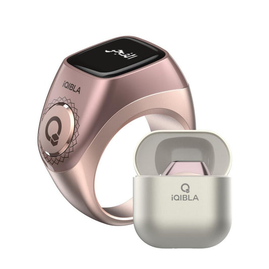 Rose gold iQibla Flex Pro dhikr ring with OLED screen and metallic charging case – Islamic smart tasbeeh counter ring.