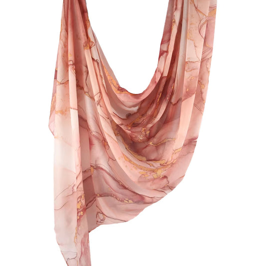Front view of Sundara Cotton Hijab in blush and gold tropical marble design

Soft breathable cotton hijab with lightweight drape

Stylish printed cotton headscarf for modest everyday wear

Elegant non-slip cotton hijab for Muslim women
