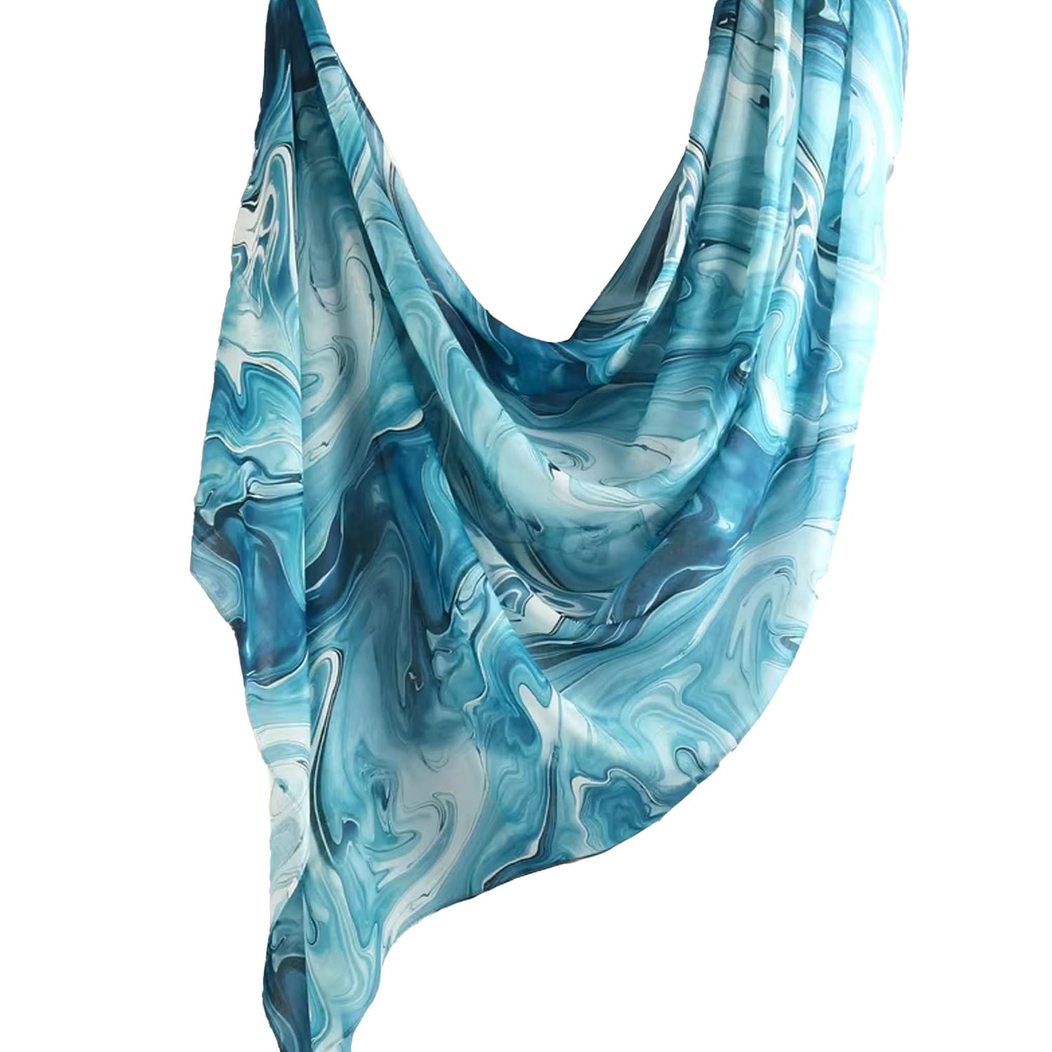Cotton-modal hijab in a vibrant aqua marbled pattern named Tidea, featuring flowing turquoise and deep blue tones for a bold, tropical-inspired look.
