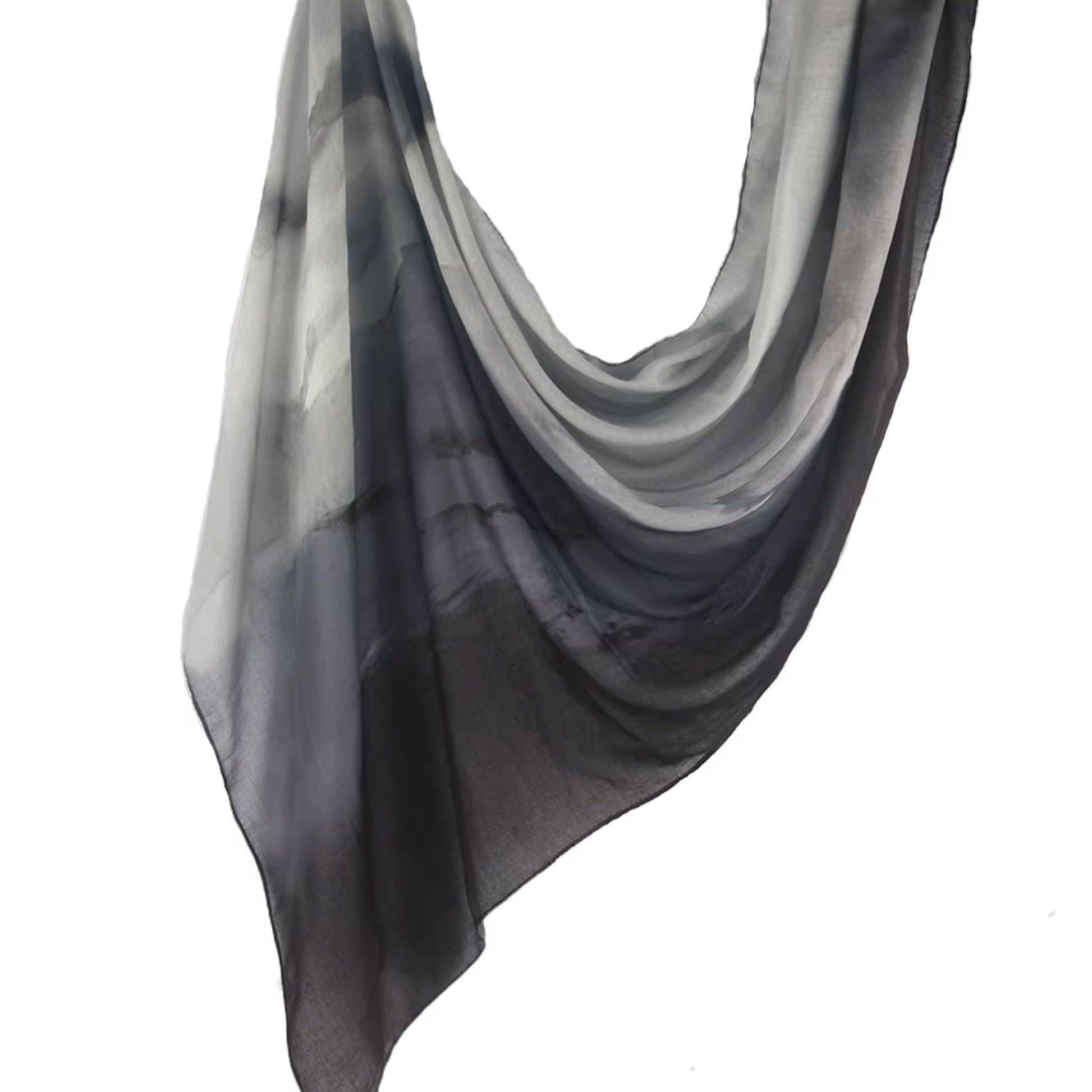 Charcoal to ash ombré cotton-modal hijab with lightweight drape, evoking volcanic tones for bold and refined modest fashion.
