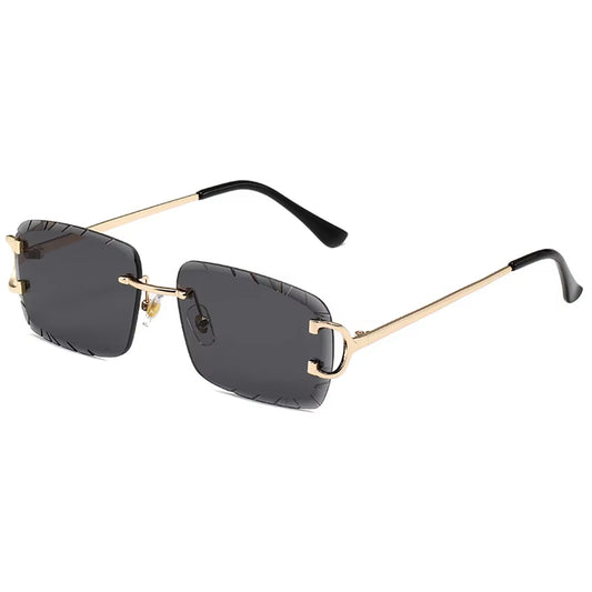 Gold metal vintage-style rimless sunglasses with black engraved lenses and curved arms – Velvet Eclipse collection.